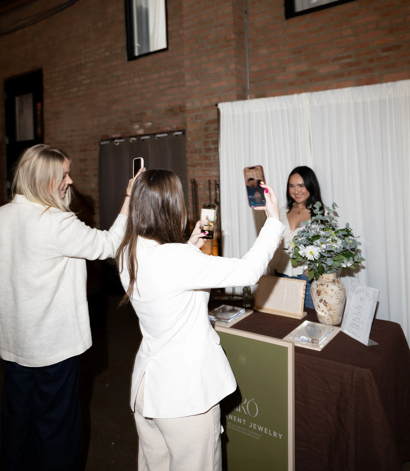 Guests connecting with a jewelry business at the conference