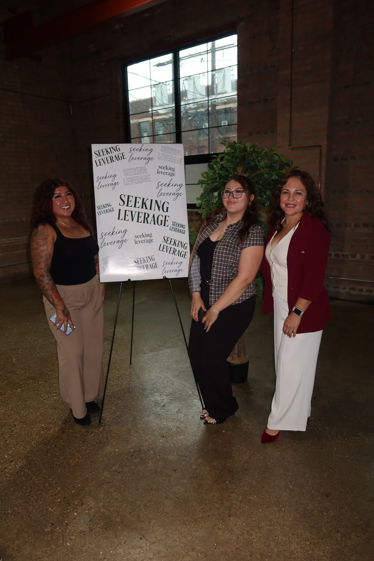 Guests gathered beside the conference welcome sign